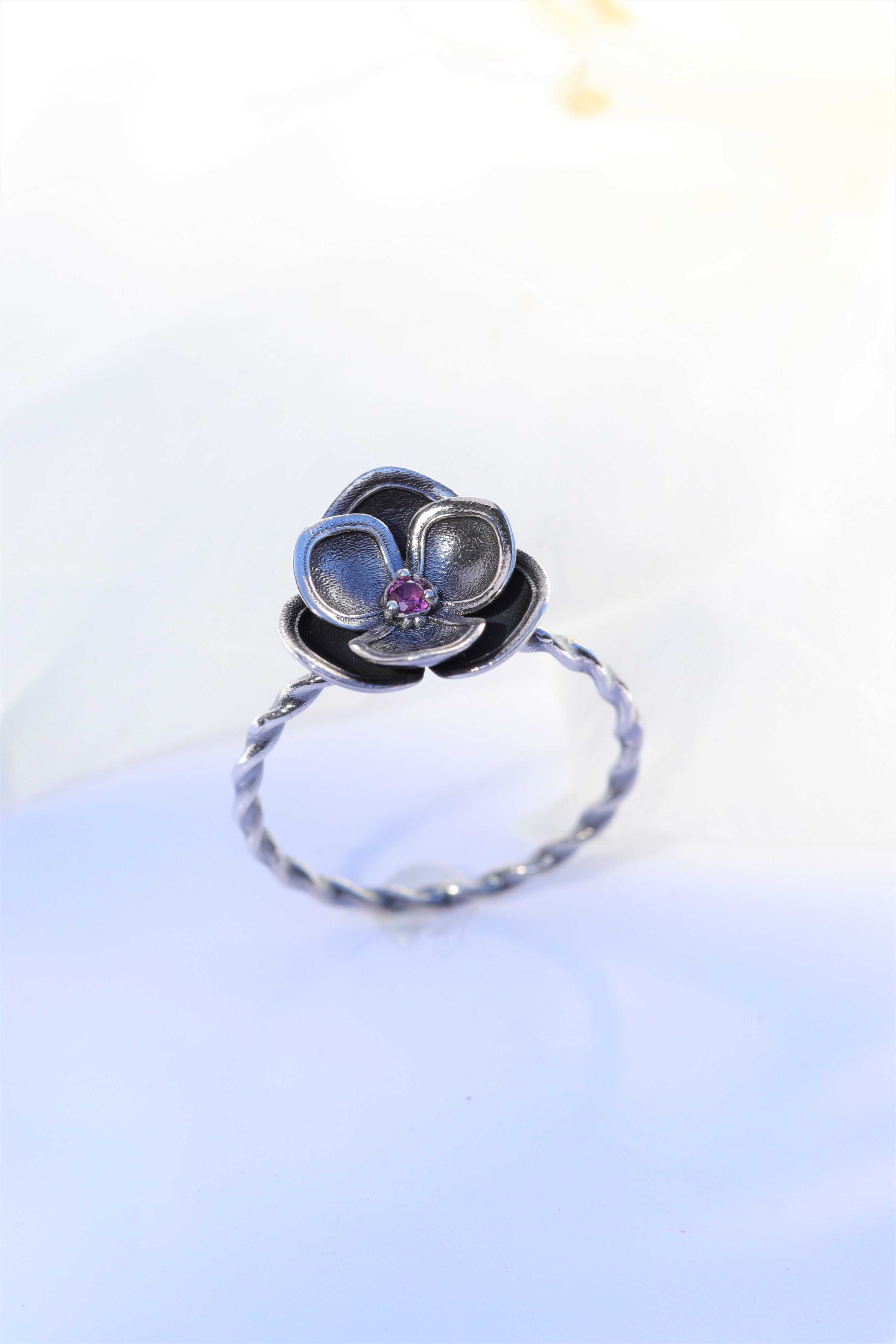 Flower ring with rhodolite stone